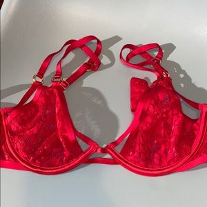 Red lacy and strappy Victoria’s Secret bra